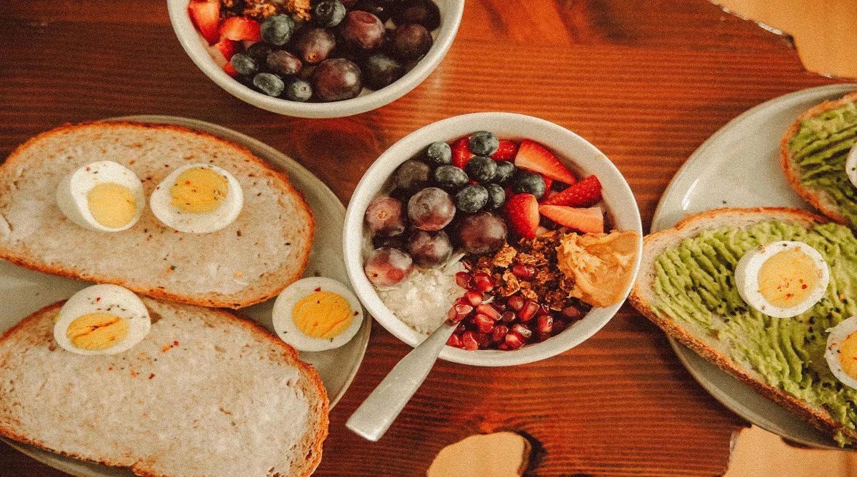 healthy bites for late-morning snacks with yogurt fruit nuts eggs toast and hummus