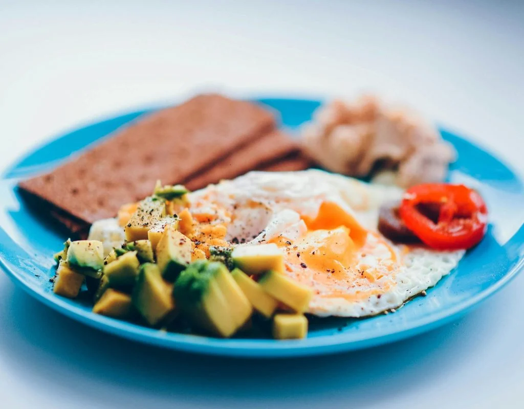 Boiled eggs and whole grain crackers on a plate