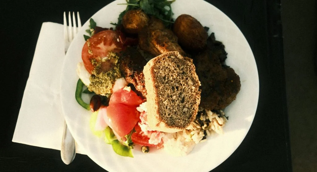 Simple bowls and plates of protein-rich foods for shared lunch
