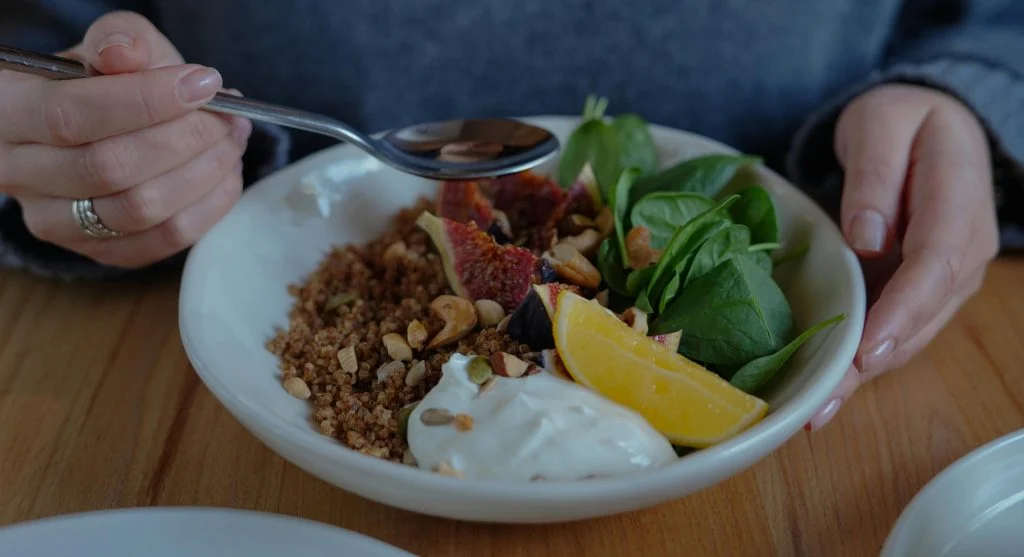 A selection of healthy comfort foods including soup, toast, fruit, and yogurt