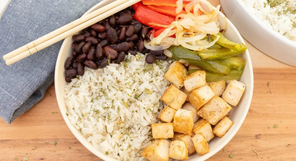 Food picks in a rice and bean bowl for quick and balanced dinners