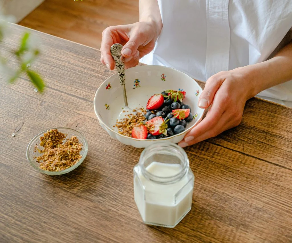 Yogurt, berries, and nuts on a plate