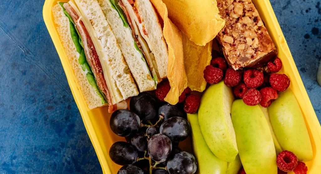 Healthy bites for study sessions with cheese grapes and whole grain crackers in a snack box