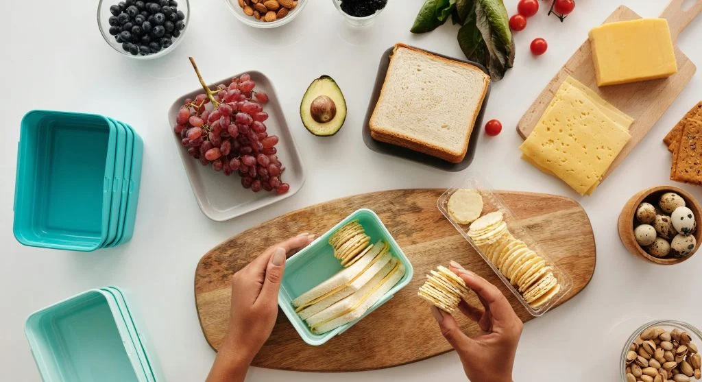 Smart cooking habits with one-pan meal leftovers packed into containers for later meals
