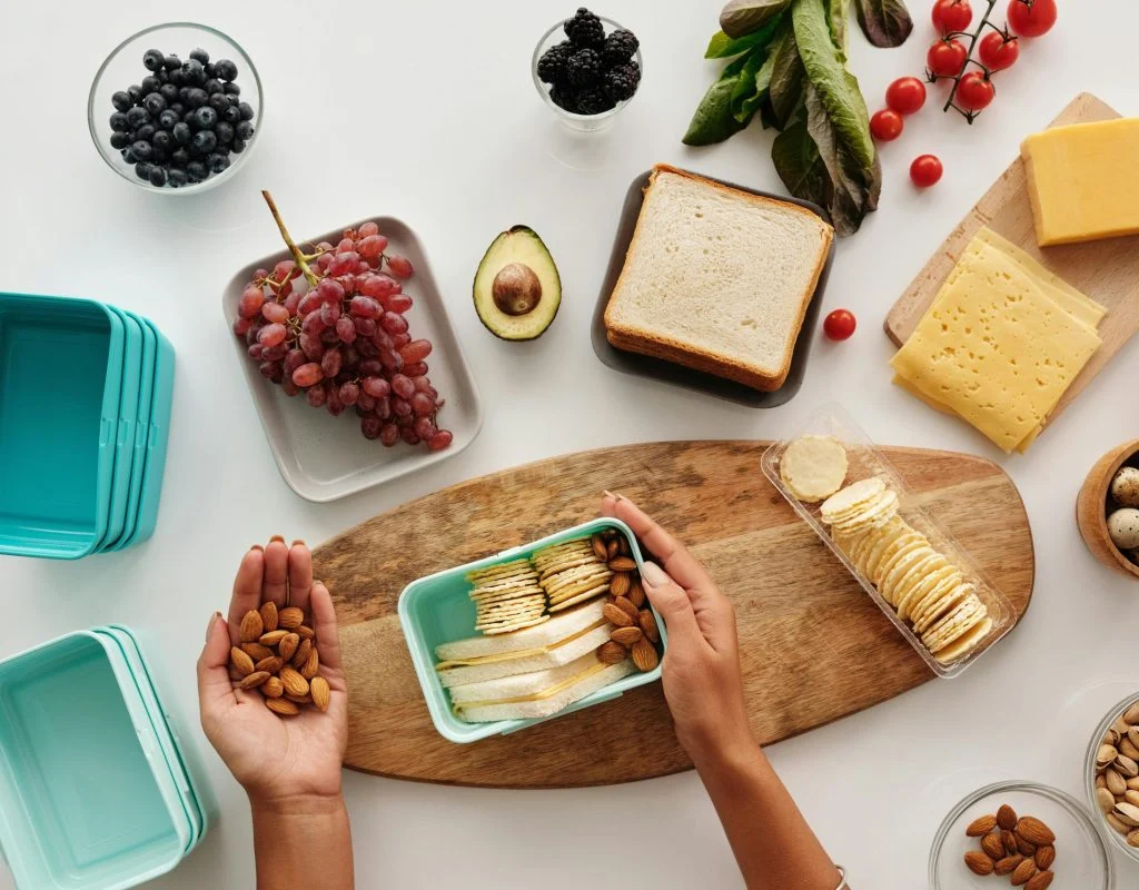 Photo of healthy snack with cheese, grapes, and whole grain crackers