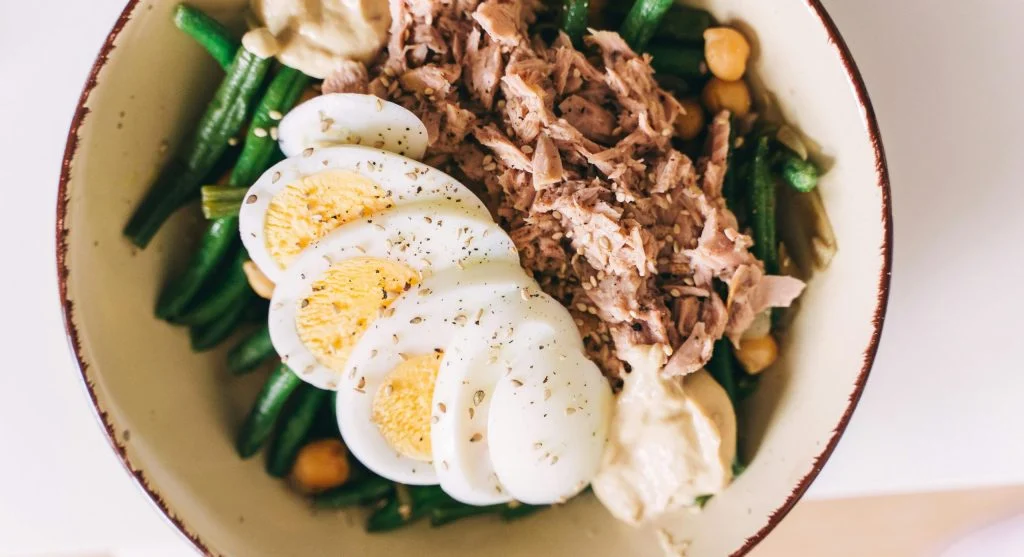 Food picks with hummus, crackers, vegetables, and boiled eggs