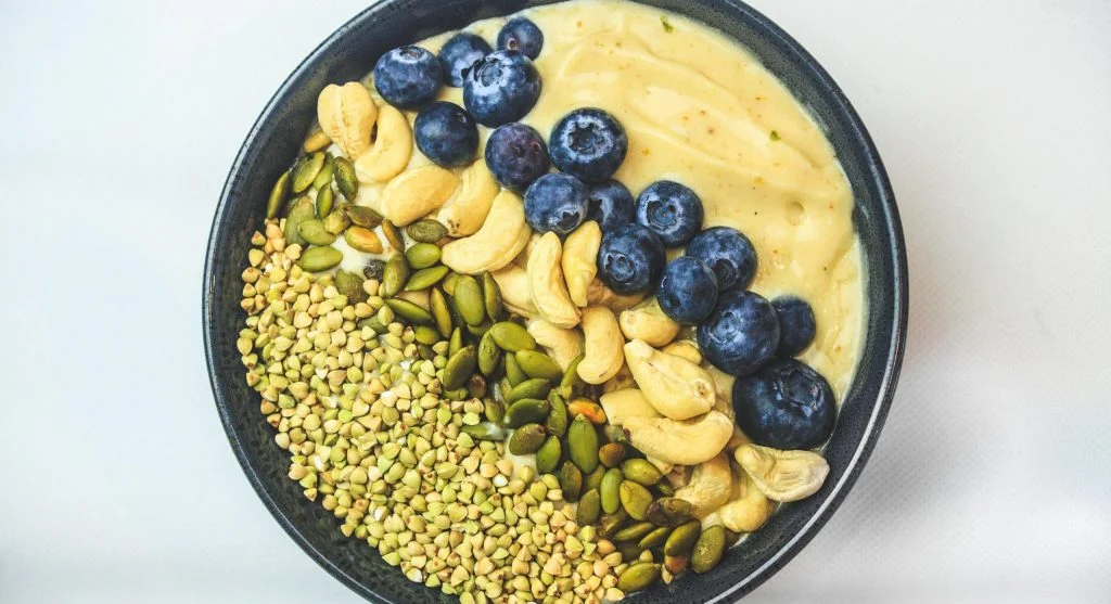 smoothie bowl with berries nuts seeds