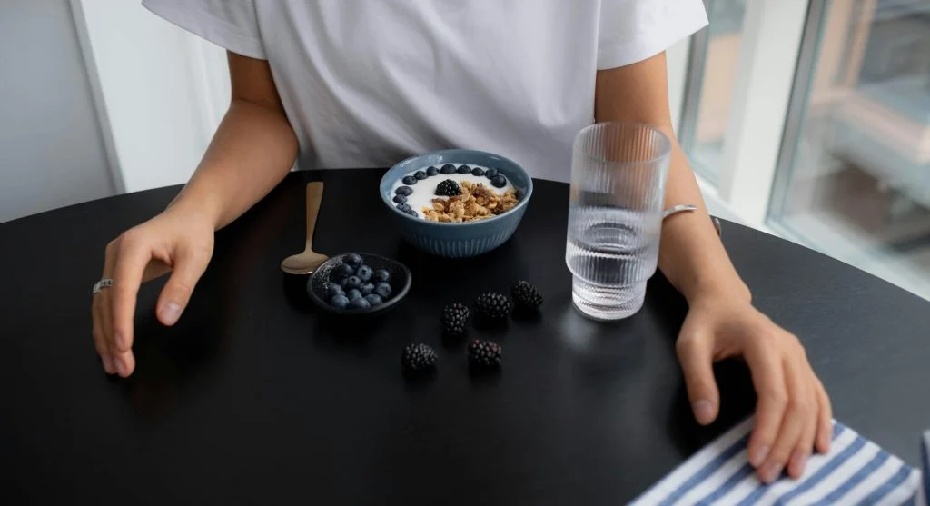 A calm and organized evening snack setup with fresh fruit and nuts