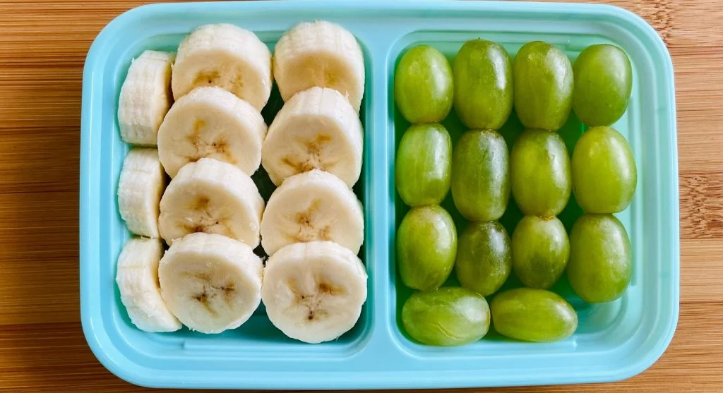 snack box with grapes nuts crackers cheese