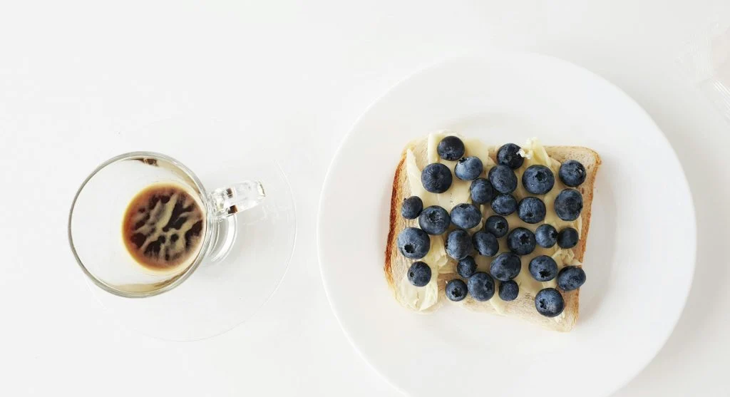 breakfast food beside coffee cup